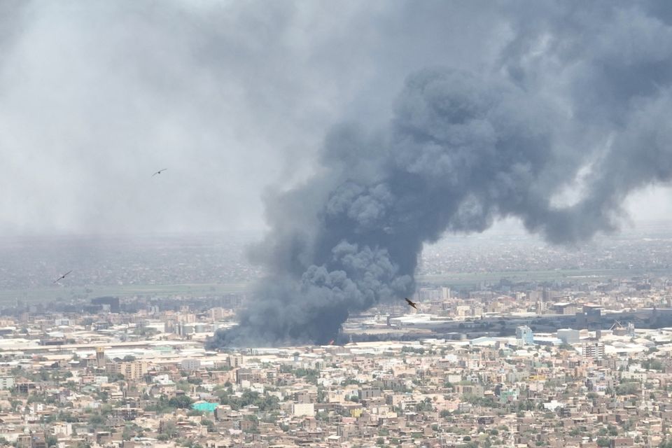 Drone footage of black smoke billowing over Khartoum. Photo: Reuters