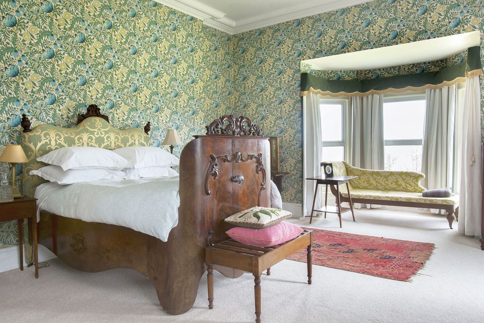 The bedrooms are all decorated differently. This one is called the William Morris Room because of the wallpaper.