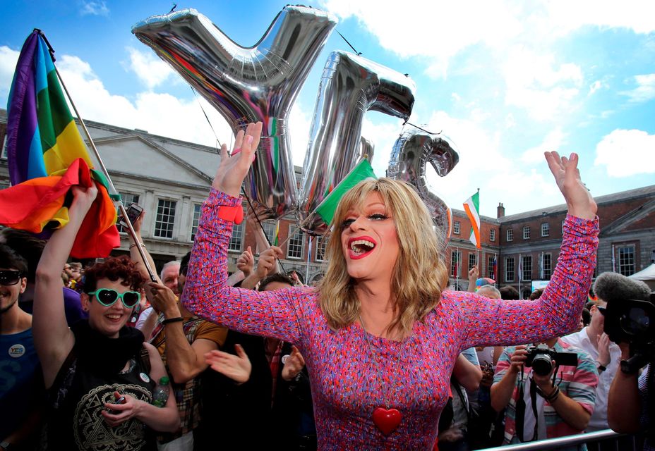 Drag queen and gay rights activist, Rory O'Neill, also known by his stage name Panti raises her arms by supporters for same-sex marriage at Dublin Castle as they wait for the result of the referendum on May 23, 2015. Yes voters were basking in the sunshine today as they gathered to celebrate an expected victory in Ireland's referendum on whether to approve same-sex marriage.
AFP PHOTO /  Paul FaithPAUL FAITH/AFP/Getty Images