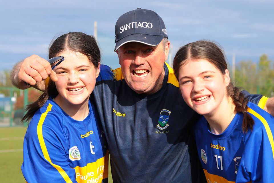 Emily, Maurice and Niamh Wafer celebrate after Carnew Emmets beat Annacurra in the Wicklow Camogie Cup final to secure their place at the 2024 Féile na nGael competition. Photo: Joe Byrne