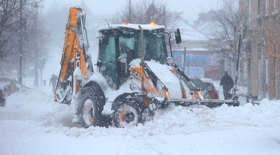 A JCB clears the snow in Rathcoole, Co. Dublin. Picture credit; Damien Eagers 2/3/2018
