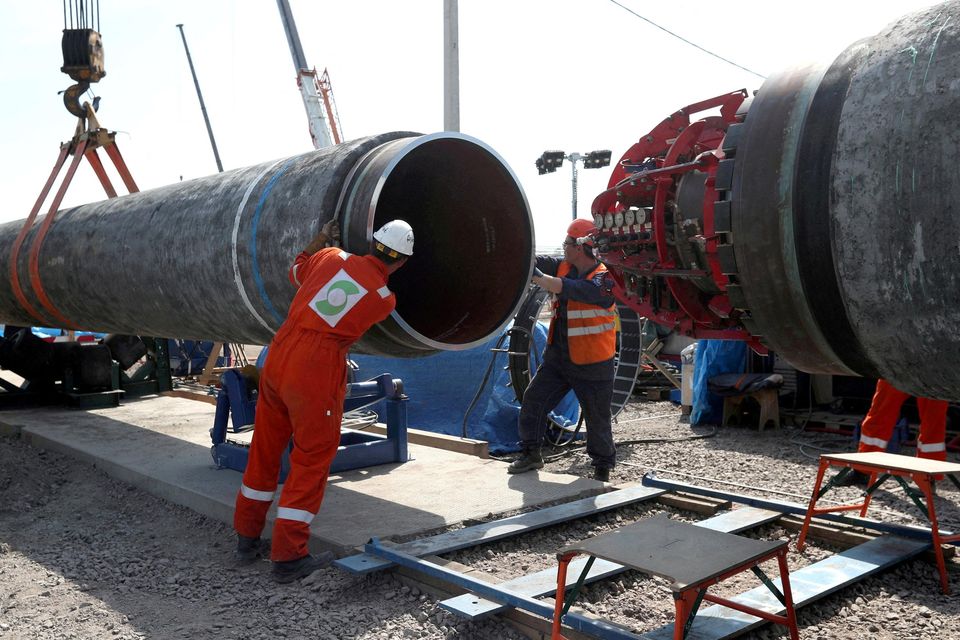 Engineers in Russia inspect a segment of the Nordstream 2 pipeline. File picture by Anton Vaganov/Reuters