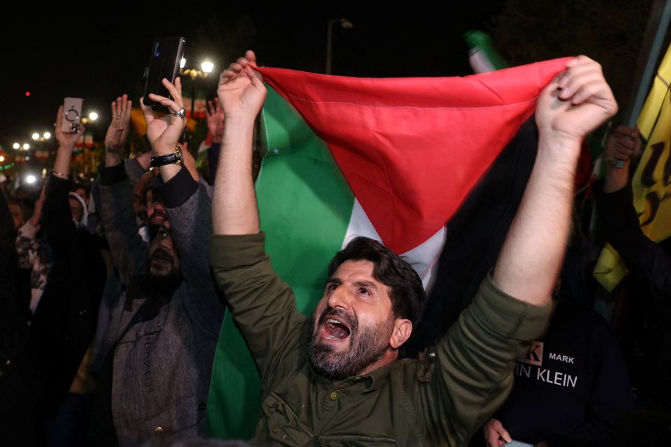 Iranian demonstrators react after the attack on Israel, during an anti-Israeli gathering in front of the British Embassy in Tehran, Iran. Photo: PA