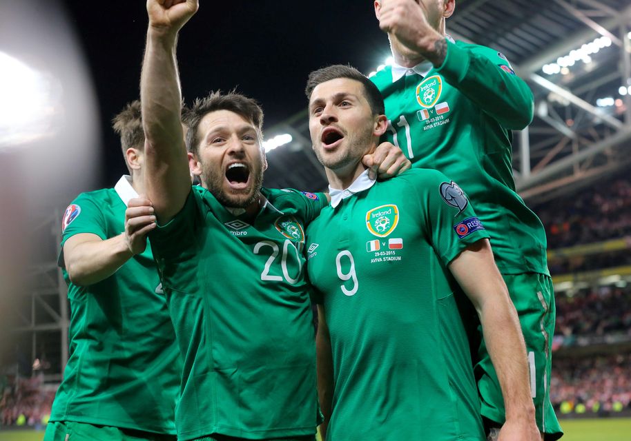 Republic of Ireland's Shane Long (right) celebrates scoring his sides opening goal  during the UEFA Euro 2016 Qualifier at the Aviva Stadium, Dublin, Ireland. PRESS ASSOCIATION Photo. Picture date: Sunday March 29, 2015. See PA story SOCCER Republic. Photo credit should read: Niall Carson/PA Wire