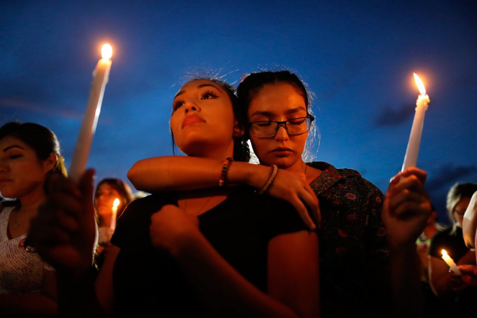 Grief: People attend a candlelight vigil for the victims of the mass shooting in El Paso, Texas