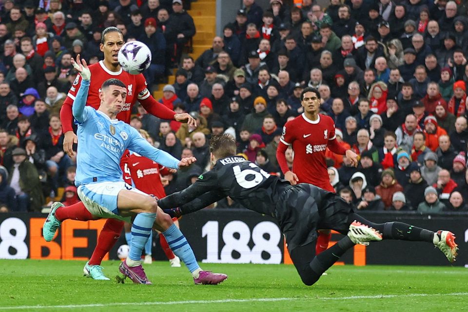 Liverpool's Caoimhín Kelleher foils Manchester City's Phil Foden during the Premier League clash at Anfield