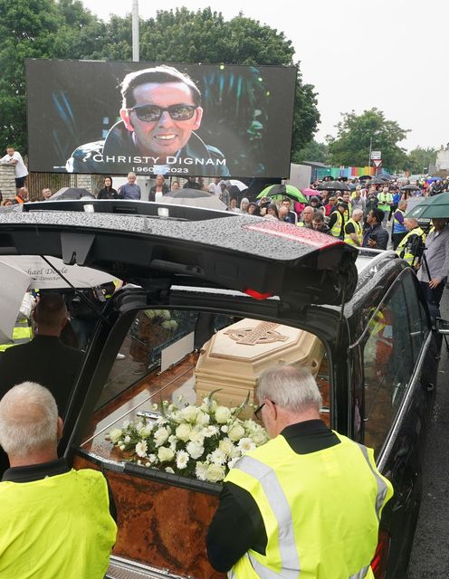The funeral cortege of Christy Dignam stops at Farnham Drive at Erins Isle GAA Club (Brian Lawless/PA)