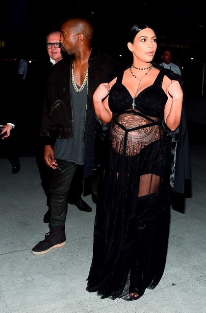 Rapper Kanye West (L) and television personality Kim Kardashian attend the Givenchy fashion show during Spring 2016 New York Fashion Week at Pier 26 at Hudson River Park on September 11, 2015 in New York City.  (Photo by Michael Loccisano/Getty Images)
