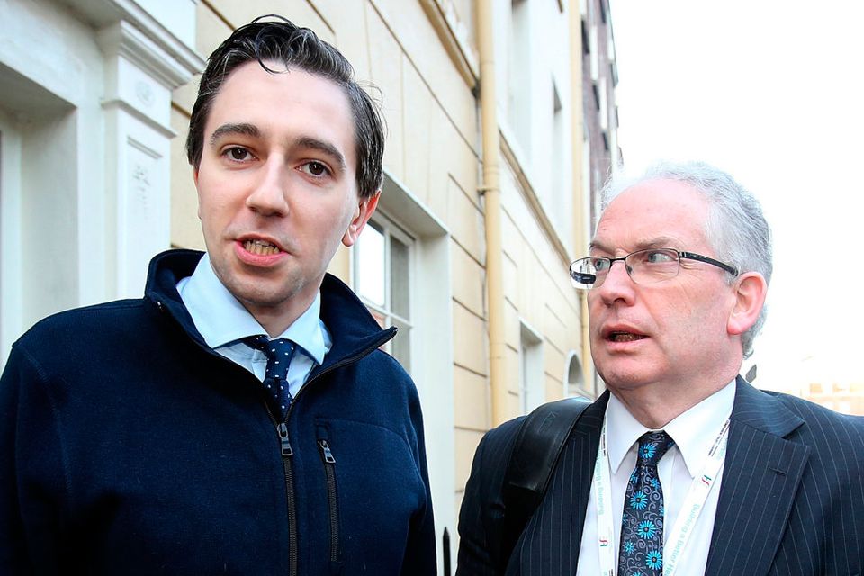 Health Minister Simon Harris and former HSE boss Tony O’Brien. Photo: Tom Burke