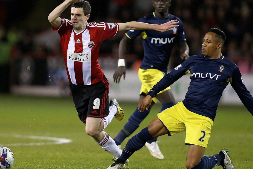 Sheffield United's Jamie Murphy is challenged by Southampton full-back Nathaniel Clyne during their Capital One Cup quarter-final clash at Bramall Lane. Photo: REUTERS/Andrew Yates