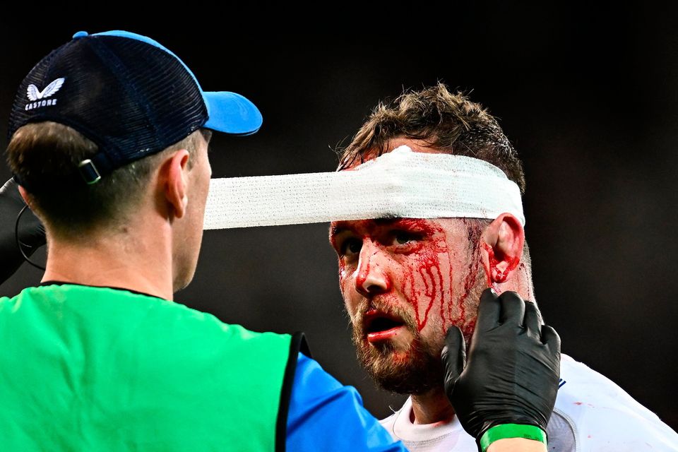 Ed Byrne of Leinster has his head taped by Leinster senior physiotherapist Darragh Curley during the United Rugby Championship against the DHL Stormers at the DHL Stadium in Cape Town, South Africa. Photo: Harry Murphy/Sportsfile
