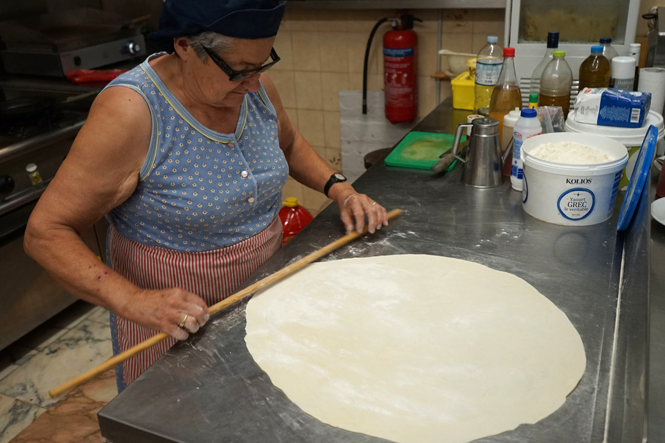 Mrs Tassia making cheese pie at Tassia's, Alonnisos. PA Photo/Jonathan Williams.