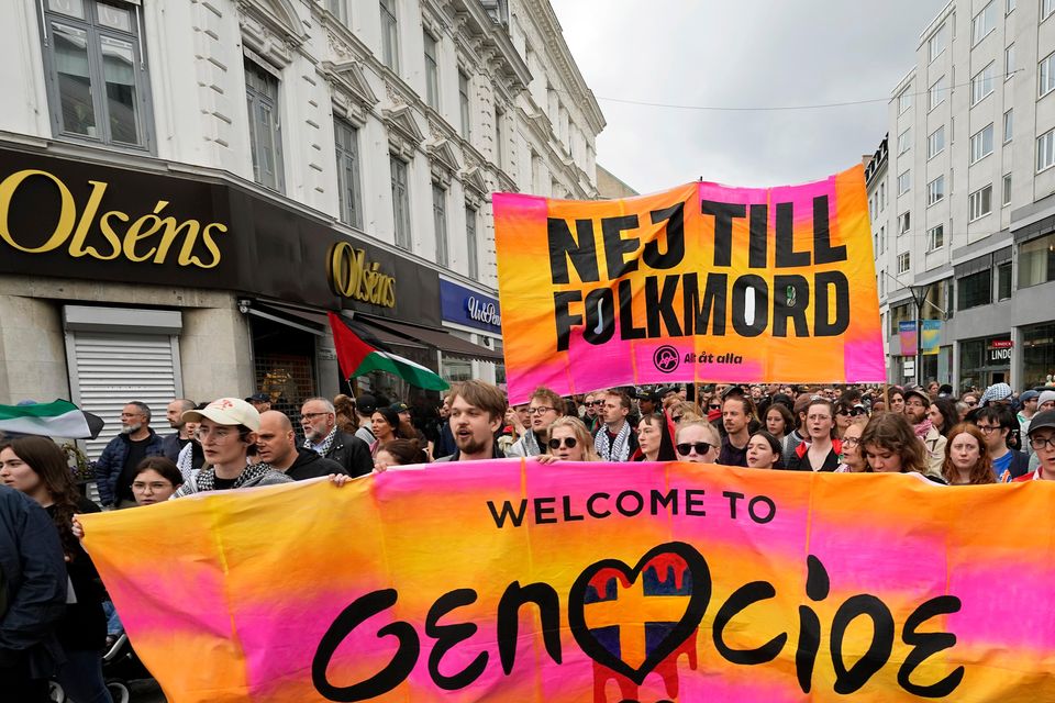 Protesters hold up a banner with the words in Swedish No To Genocide (Martin Meissner/AP)