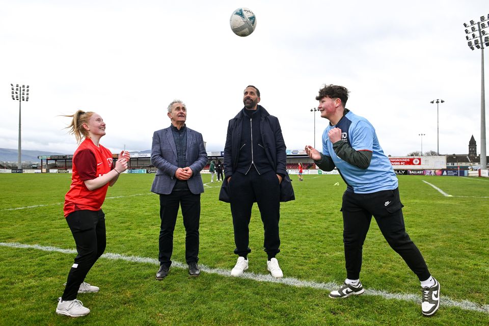 Rio Ferdinand and Paddy Harte, chair of the IFI, with Phoebe Wallace from Enniskillen and Torry Sloan from Omagh. Photo by David Fitzgerald/Sportsfile
