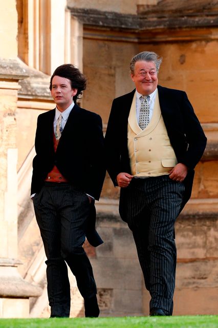 British comedian and writer Stephen Fry (R) arrives with his husband comedian Elliott Spencer (L) to attend the wedding of Britain's Princess Eugenie of York to Jack Brooksbank at St George's Chapel, Windsor Castle, in Windsor, on October 12, 2018. (Photo by Adrian DENNIS / various sources / AFP)ADRIAN DENNIS/AFP/Getty Images
