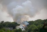 thumbnail: Fire crews attend to the scene of a house fire in North Clare this afternoon believed to have been started by a lightning strike (Photograph: Liam Burke, Press 22)