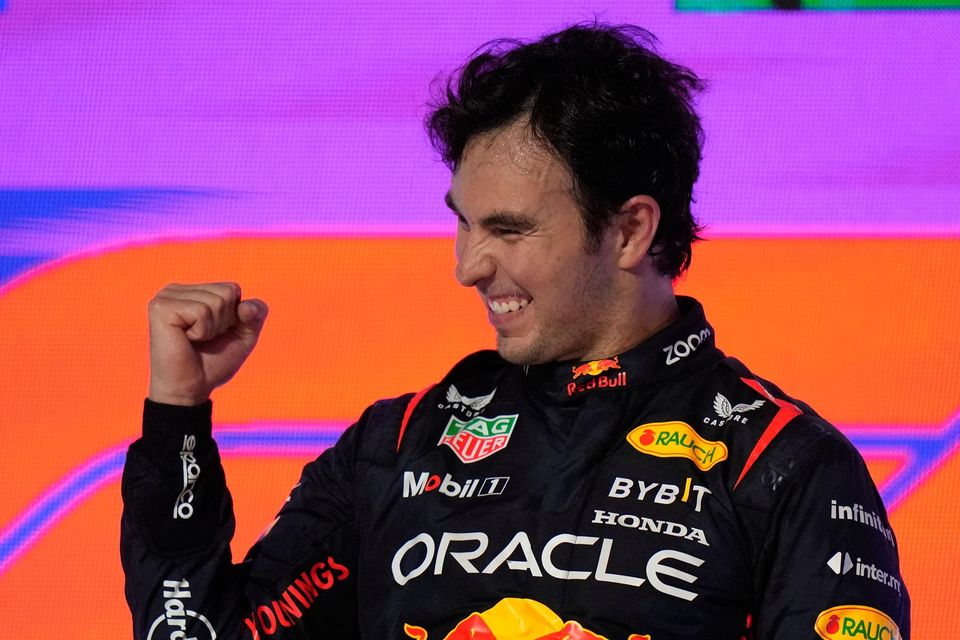 Red Bull's Mexican driver Sergio Perez celebrates after he won the Saudi Arabia Formula One Grand Prix at the Jeddah corniche circuitSunday, March 19, 2023. Photo: AP