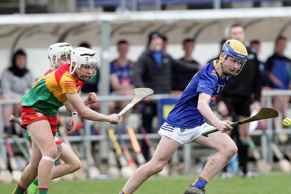 Wicklow's Kenneth Cullen gets away from Carlow's Kyle Nolan.