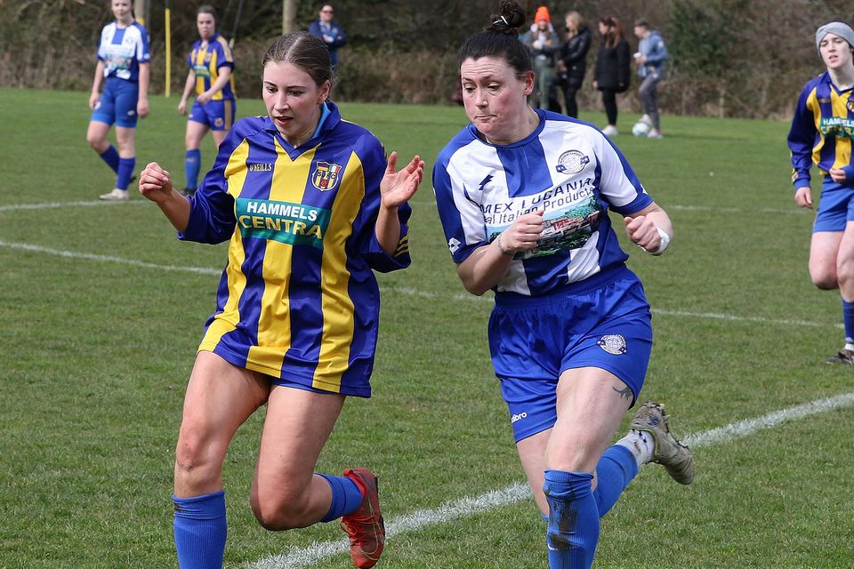 Jessica Foran of St. Joseph's is challenged by Tanya McDonald of Aughrim Rangers.
