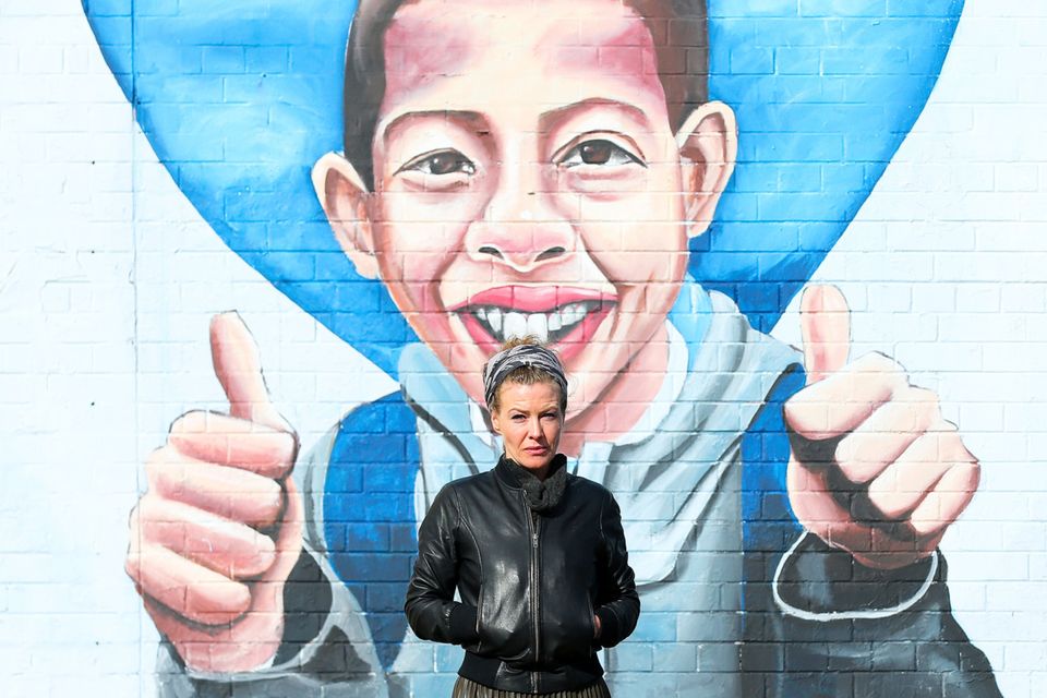 Fiona Donohoe in front of a mural of her son in Belfast. Photos: Jonathan Porter/PressEye