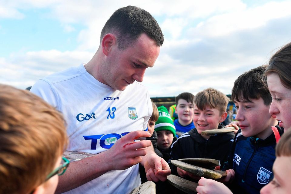 Stephen Bennett of Waterford signs autographs for young supporters after the Allianz Hurling League Division 1 Group B win over Tipperary at Walsh Park in Waterford. Photo: Eóin Noonan/Sportsfile