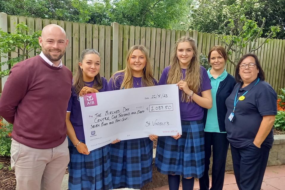 Teacher Mr David Campion and students  Hannah Roche, Hannah Lynch, Darcy Maguire from TYB, St Vincent's Secondary School presenting a cheque to The Birches, Dundalk