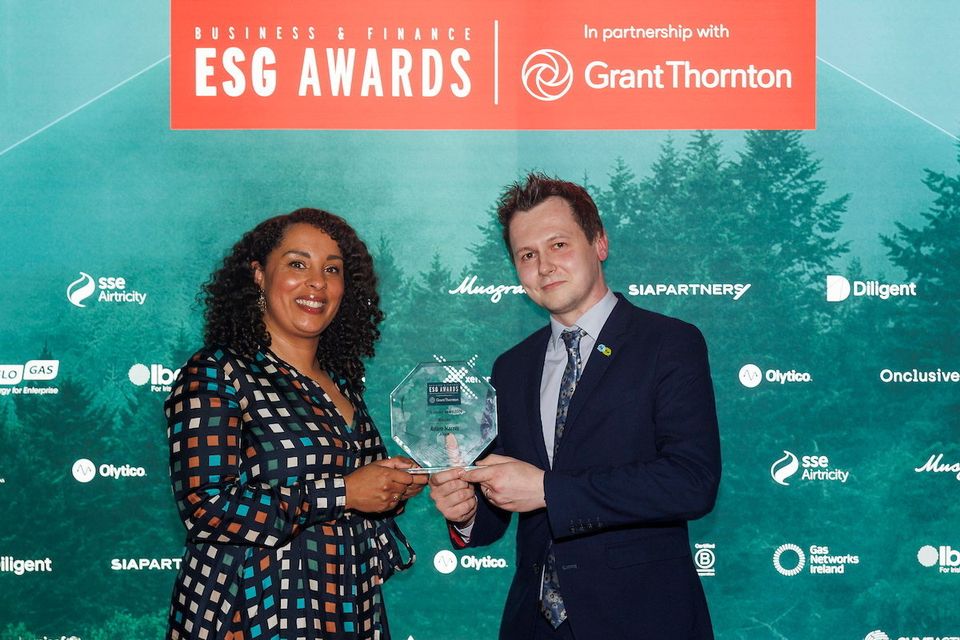 Adam Harris, from ASIAM collecting the ESG Leader Award presented by Catherine Duggan and Aisling McCaffrey  from Grant Thornton (left). Photo: Andres Poveda.