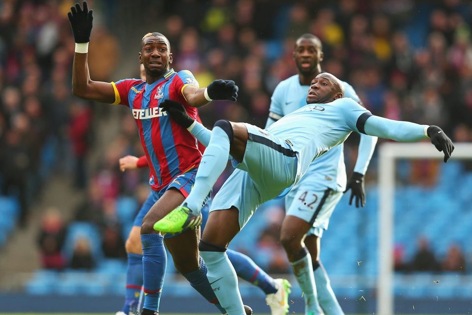 Manchester City defender Eliaquim Mangala is challenged by Crystal Palace's Yannick Bolasie during their Premier League clash at the Etihad. Photo: Alex Livesey/Getty Images