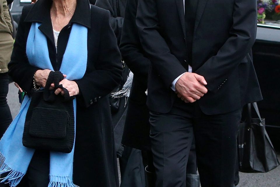 Niall Quinn, (son) and his mother, Mary, (wife), at St Marys Church, Killenaule, Co. Tipperary at the funeral of Billy Quinn