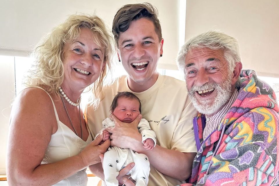 Tadhg Fleming with parents Derry and Maureen and his newborn baby Rae