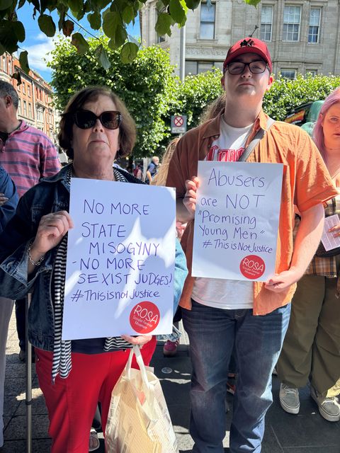 Marie Clynes, a retired teacher from Dublin, and Tristan McCall, who travelled from County Wicklow to attend the protest in Dublin on Saturday. Photo: Cate McCurry