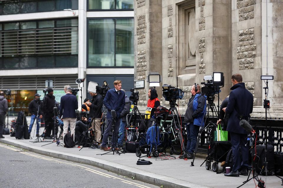 Media wait outside the Rolls Building of the High Court on the day, when Britain's Prince Harry, Duke of Sussex is set to arrive, in London, REUTERS/Hannah McKay