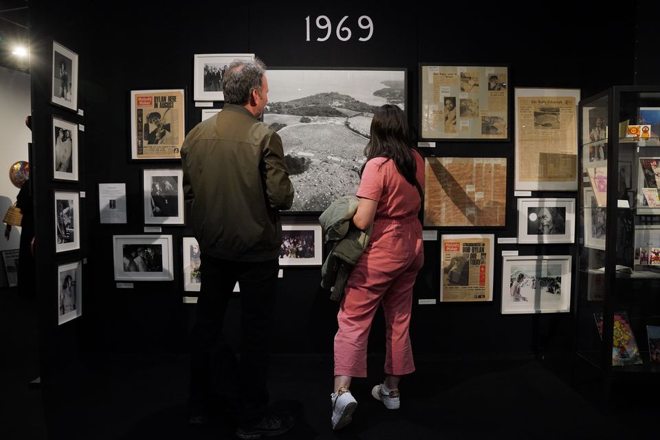 Visitors at Experience 25, an exhibition exploring the history of the Isle of Wight Festival (Jonathan Brady/PA)