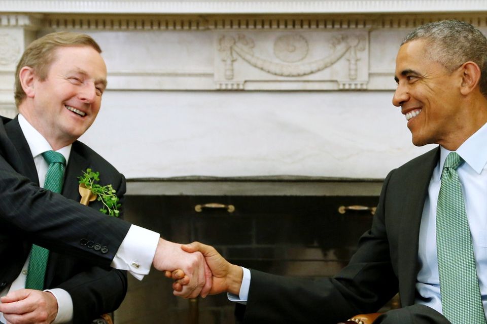 U.S. President Barack Obama (R) welcomes Ireland's Prime Minister Enda Kenny (L) to the Oval Office for a St. Patrick's Day visit at the White House in Washington March 17 2015. REUTERS/Jonathan Ernst