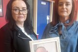 thumbnail: Tony Rogers's daughters Eleanor and Gillian (l-r) with a photo of their late father