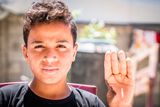 thumbnail: Horror: Pictured in Palestine was 14-year-old Amed Alhalw who told John: "I lost my thumb. I have developed a bad stammer. Every noise makes me jump." Photo: John McColgan