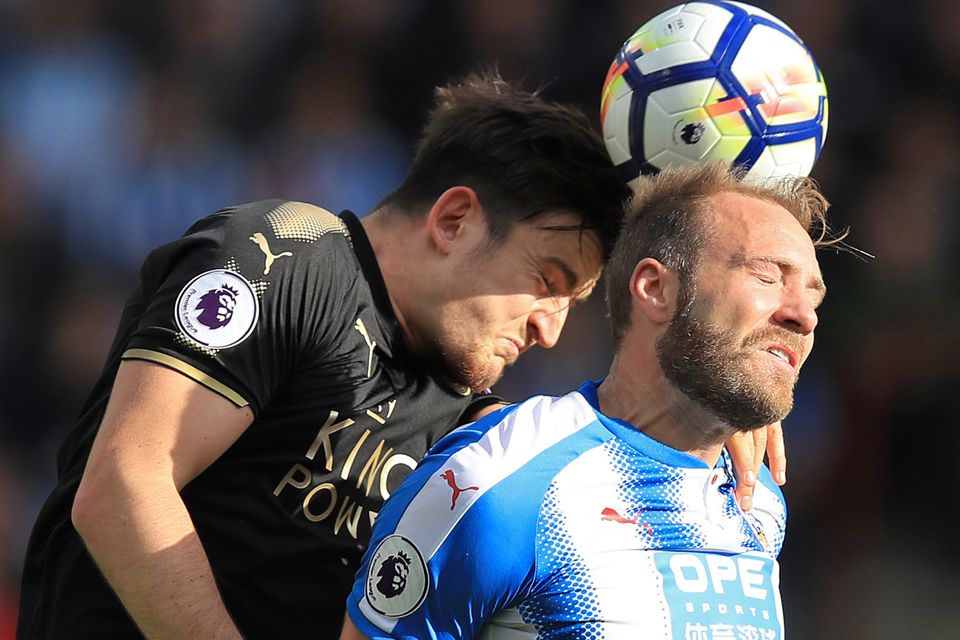 Laurent Depoitre, right, proved a handful for Leicester's Harry Maguire, left