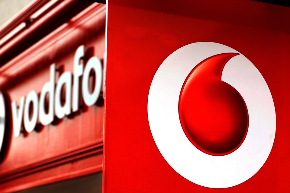 Blue chip giant Vodafone has dialled up big share gains after hiking its earnings outlook as the wider FTSE 100 Index lifted on optimism over the US-China trade war (PA)