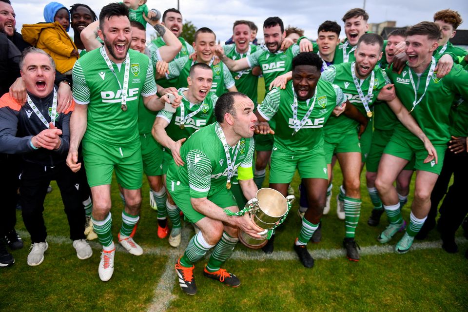 There were plenty of familiar faces, including Darius Kierans (left) and Killian Brennan (second left) as Glebe North captain Noel Barrett lifted the FAI Intermediate Cup following their victory over Ringmahon Rangers at Weavers Park on Sunday afternoon. Photo by Ben McShane/Sportsfile 