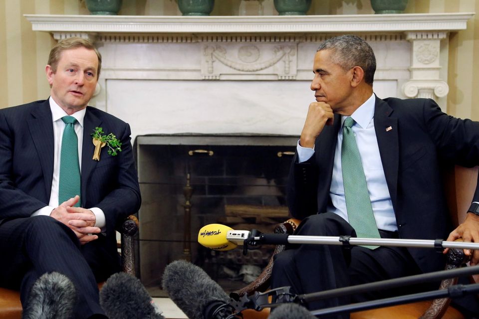 U.S. President Barack Obama (R) listens to remarks by Ireland's Prime Minister Enda Kenny after their meeting in the Oval Office as part of a St. Patrick's Day visit at the White House in Washington March 17, 2015. REUTERS/Jonathan Ernst