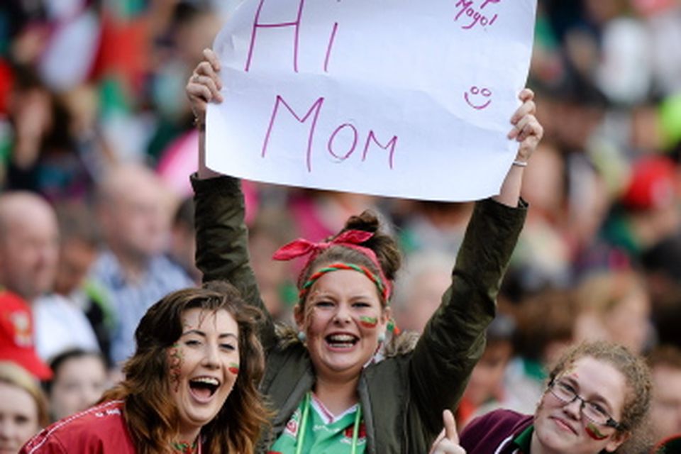 Mayo supporters Nuala Connolly, centre, from Kilmaine, and her friends Laura Muldoon, from Mulranny, and Hanna Callaghan, from Achil, send good wishes to their mother's from the Davin stand of Croke Park.