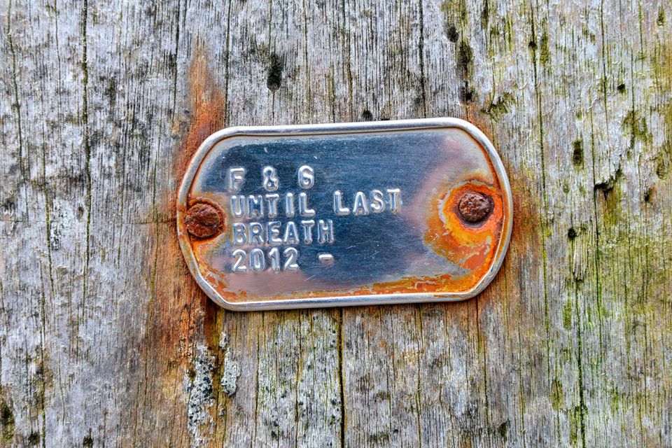 A love memento tacked to a post at Ballintoy Harbour, on the Causeway Coast. Photo: Pól Ó Conghaile