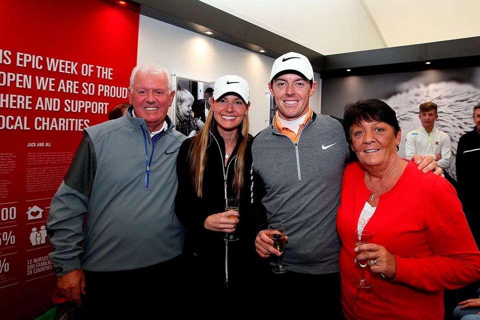 Rory McIlroy with his father Gerry, mother Rosie and fiancée Erica Stoll after victory in the final round of the final round of the Dubai Duty Free Irish Open