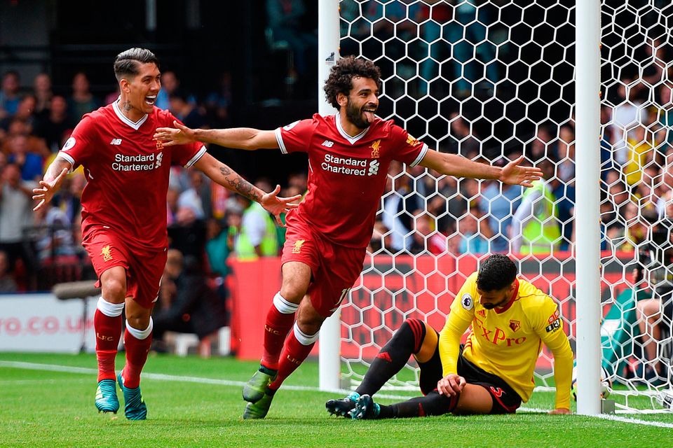 Liverpool's Mohamed Salah celebrates scoring his side's third goal