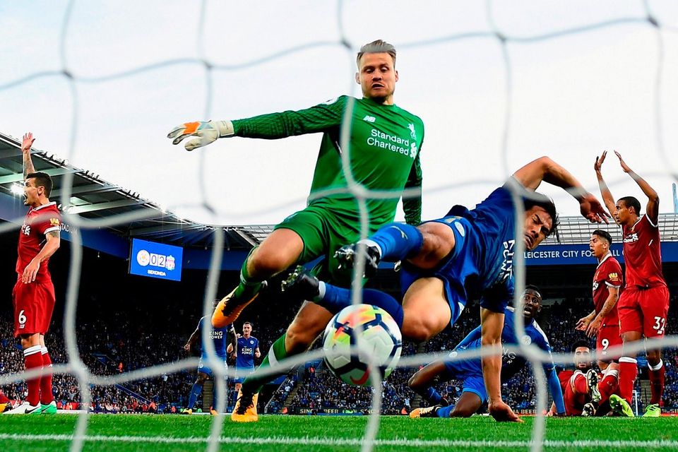 Shinji Okazaki forces the ball home for Leicester City’s second goal despite the efforts of Simon Mignolet. Photo: Laurence Griffiths/Getty Images