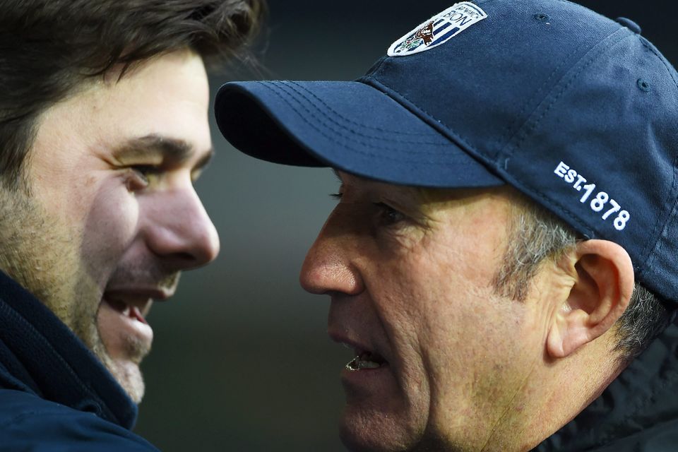 Mauricio Pochettino of Spurs and Tony Pulis the manager of West Brom greet each other prior to kickoff