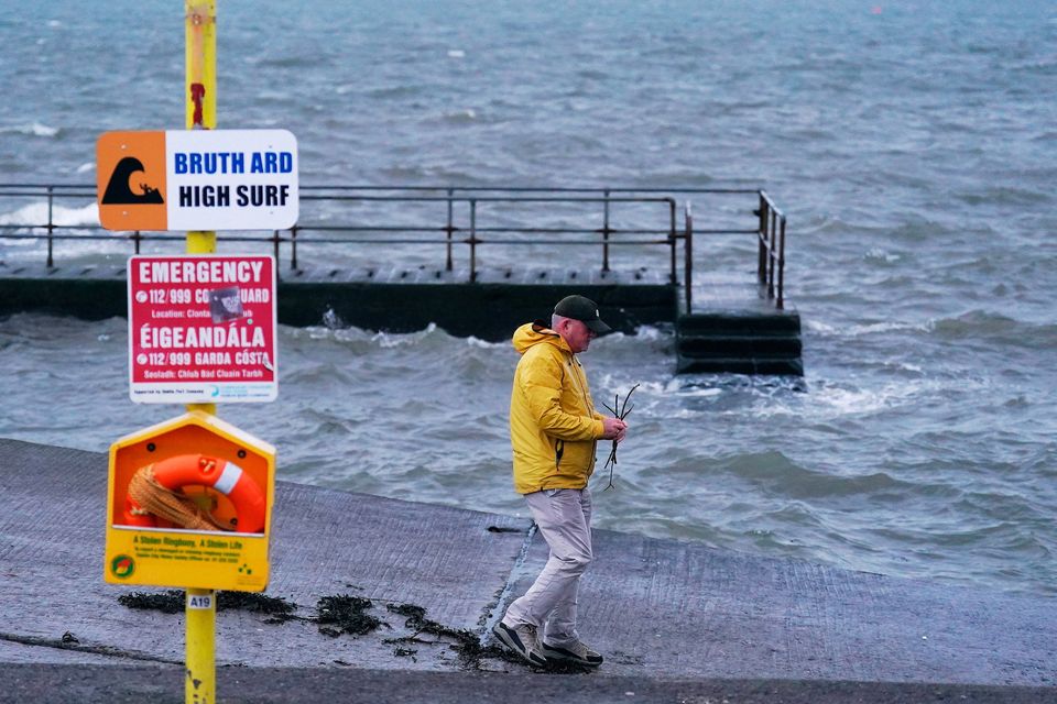A man on a slipway in Clontarf, Dublin, ahead of the arrival of Storm Darragh last year. Photo: PA