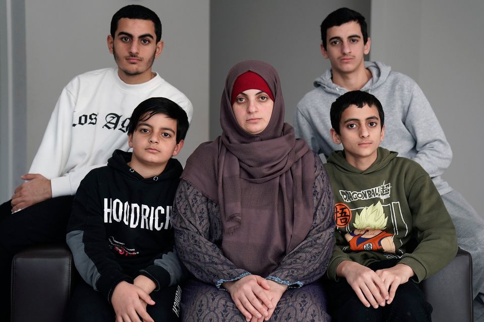 Irish citizens from Palestine Batoul Hania and her four sons Nourmohammed, 11, (front left), Ahmed, 14, (front right), Mazen, 19, (back left) and Ismael, 17, (back right) at their accommodation in West Dublin. Batoul's husband Zak was not permitted to cross the border from Gaza into Egypt with his family, despite being an Irish citizen. Picture: Brian Lawless/PA Wire