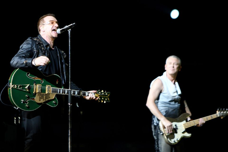 Bono and Adam Clayton onstage on the first night of their 360 tour held at Camp Nou in Barcelona. Photo: Getty Images
