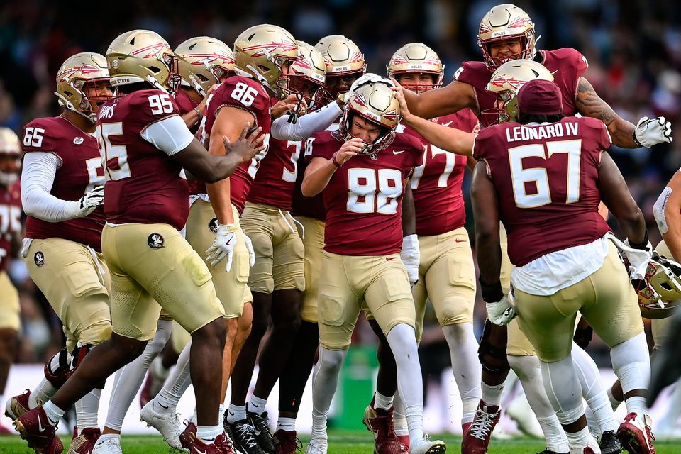 24 August 2024; Florida State Seminoles kicker Ryan Fitzgerald is congratulated by teammates after kicking a field goal during the 2024 Aer Lingus College Football Classic match between Florida State and Georgia Tech at Aviva Stadium in Dublin. Photo by David Fitzgerald/Sportsfile 